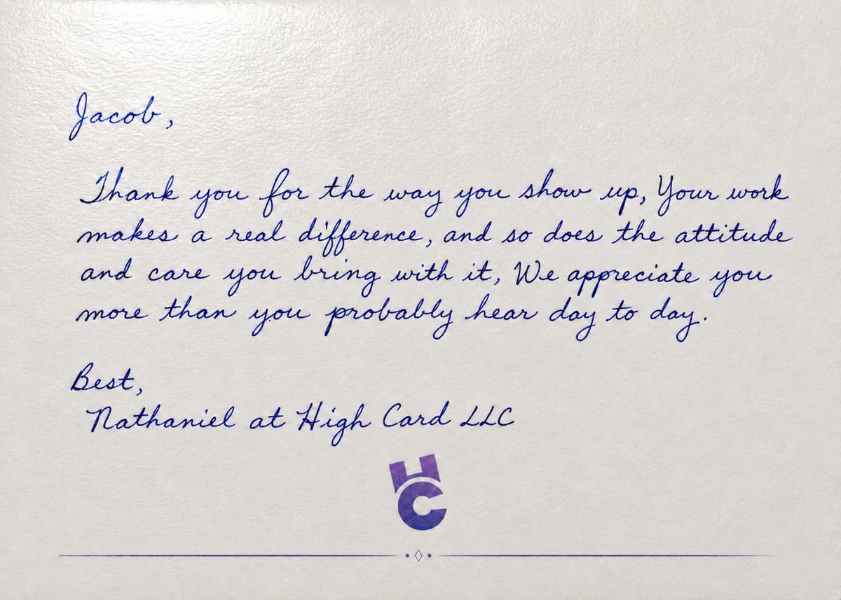 A personalized employee appreciation card written in blue ink